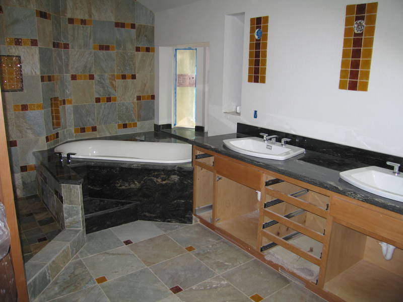 In the master bath, sinks and tub...