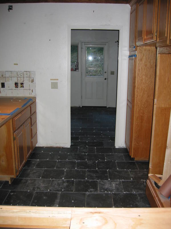 Tiles in the kitchen and in the laundry room