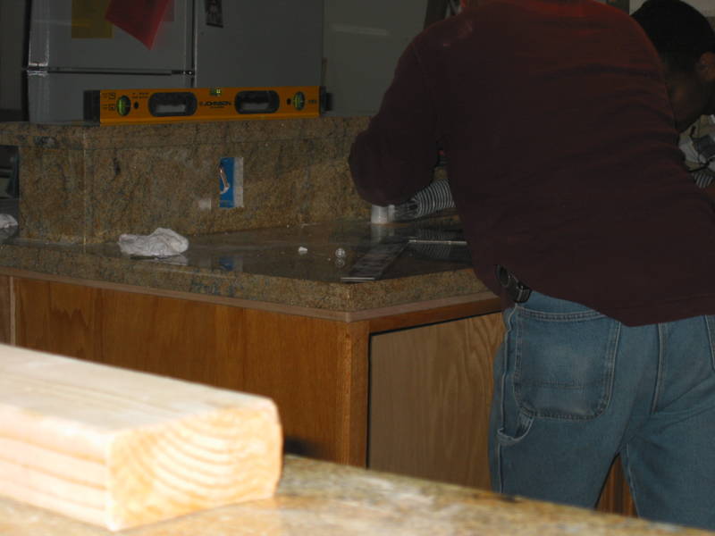 Drilling the holes for the sink, etc.  Nearly 8PM.