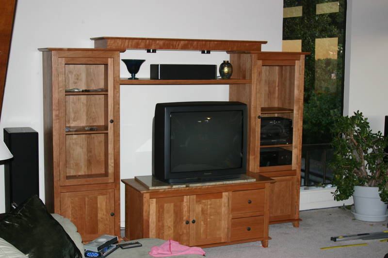 Towers placed, shelf installed with a few doo-dads, and the bridge set in place.  The center speaker takes up a lot of space. Perhaps we'll relocate it. The TV stand needs a push back (good thing we have moving men furniture sliders, now available at Home Depot and other fine stores).