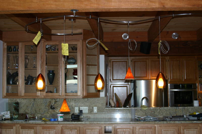 The actual dining room lights rough-placed.  The height will be adjusted later. To the left of the first light, you can see an extended mount which was added to support the weight of the lights on this side.